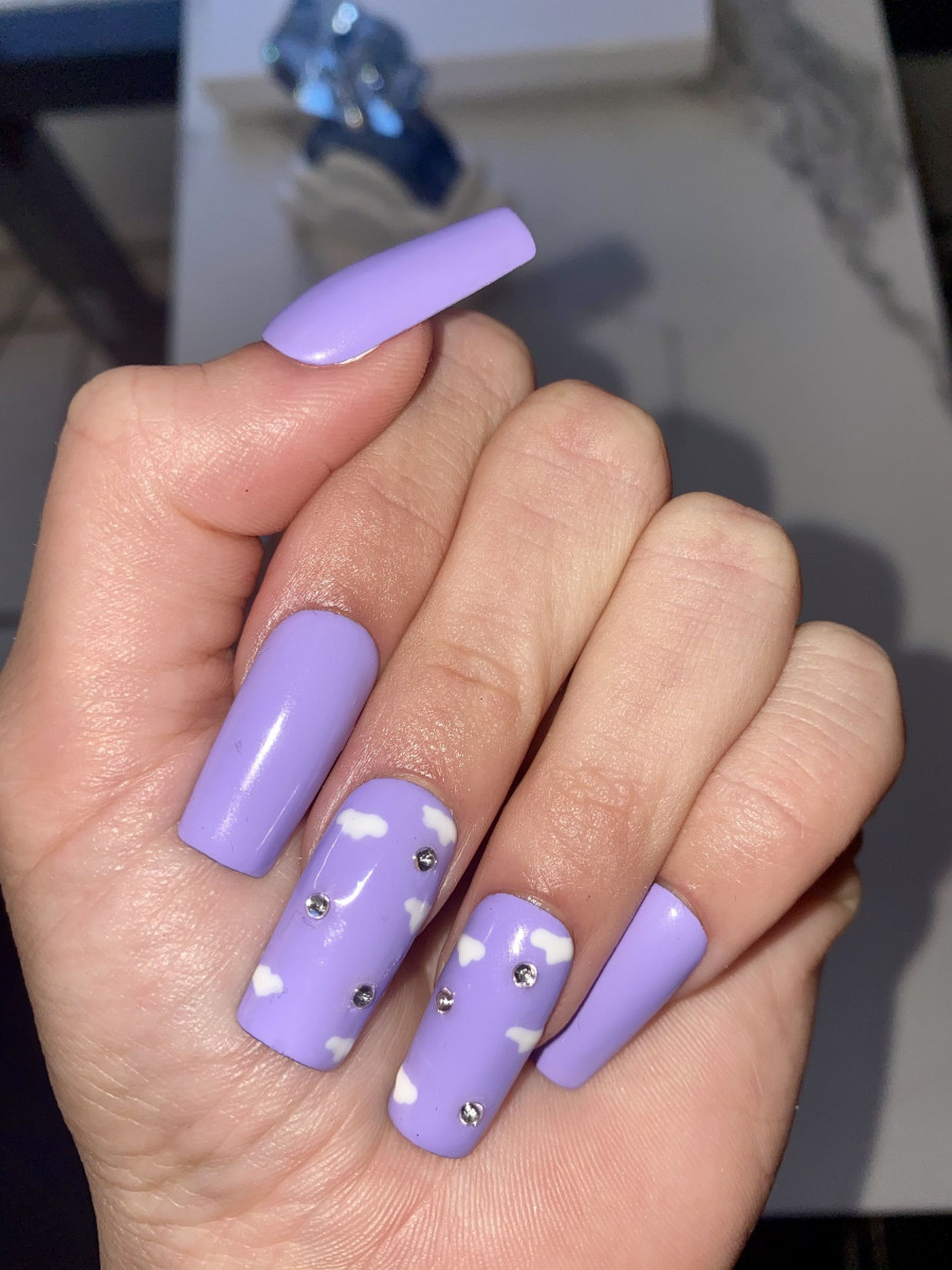 Female hands with a purple colour nails closeup Nail design Artistic  manicure with a purple nail polish Stock Photo  Adobe Stock
